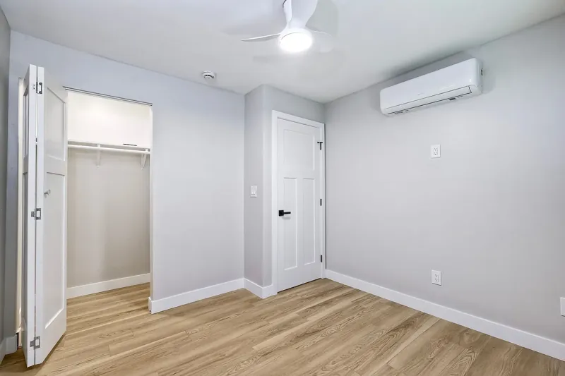 Bedroom with wood flooring