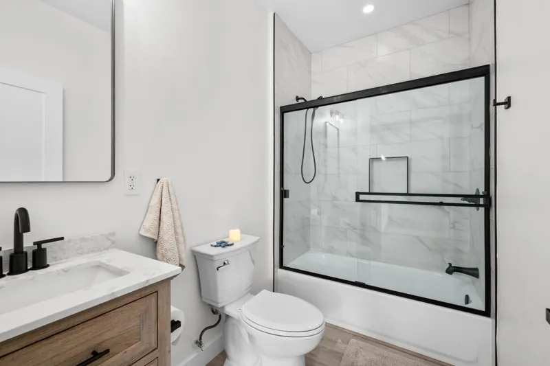 Bathroom vanity and tiled shower