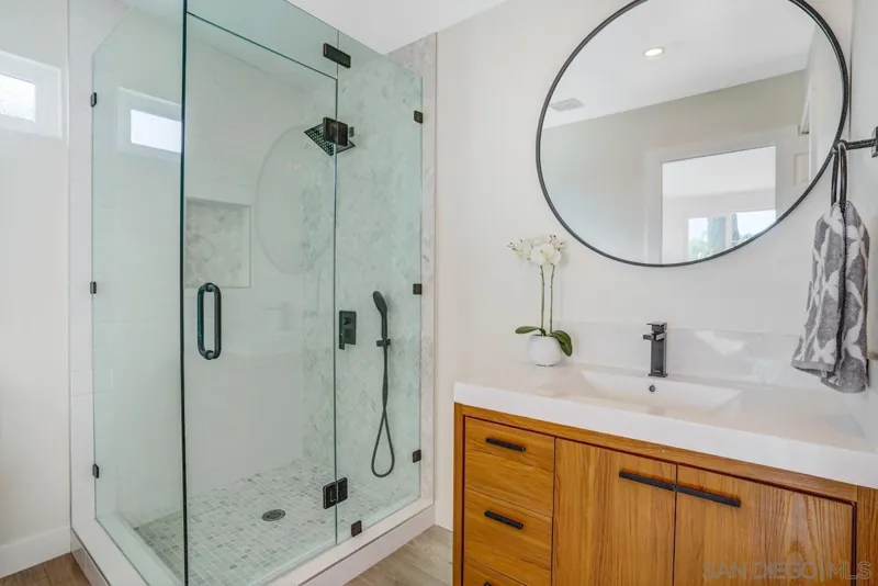 Bathroom vanity and glass shower