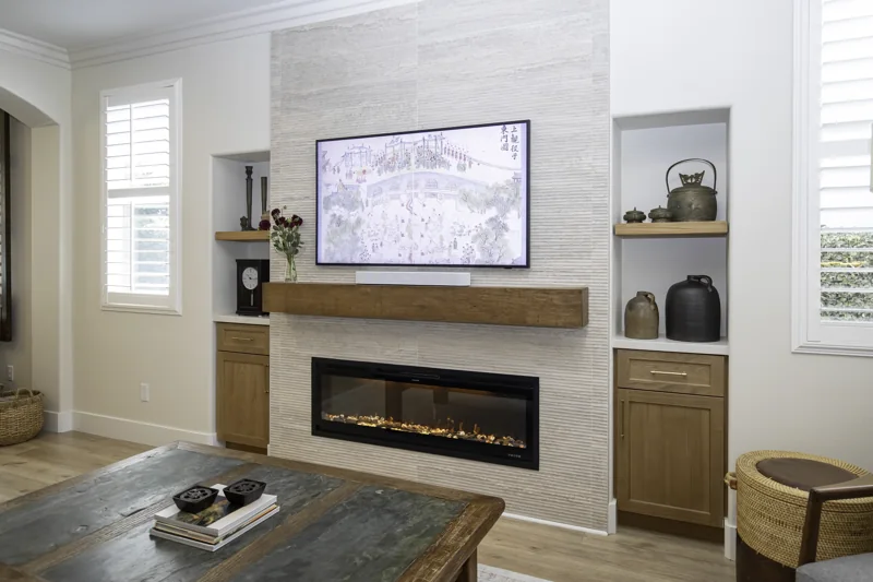 Tiled fireplace feature wall, wood mantel and built-in cabinets